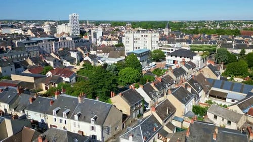 Drone flyover revealing a blend of modern and traditional architecture in European town