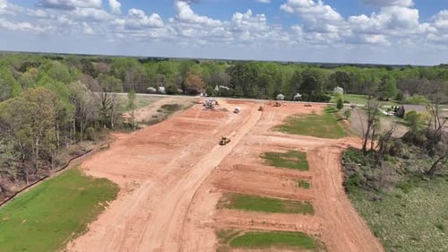 Aerial view of land clearing for new development wide shot