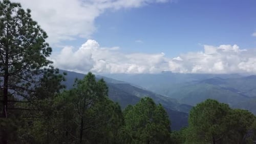 A Breathtaking Mountain Landscape Adorned with Lush Green Trees Captures the Beauty of Nature Stock