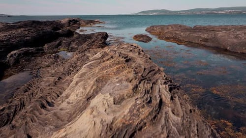 Aerial Views of Volcanic Rocky Norway Sunny Skies Illuminate Stone Textures in Untamed Wilderness