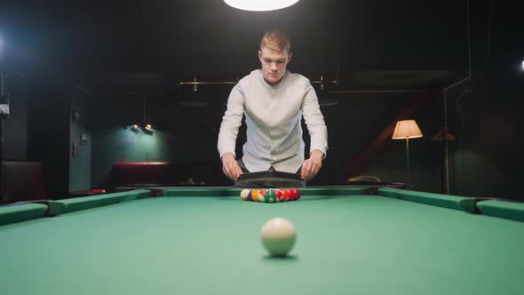 Man Arranging Billiard Balls in Triangle Formation on Green Pool Table ...