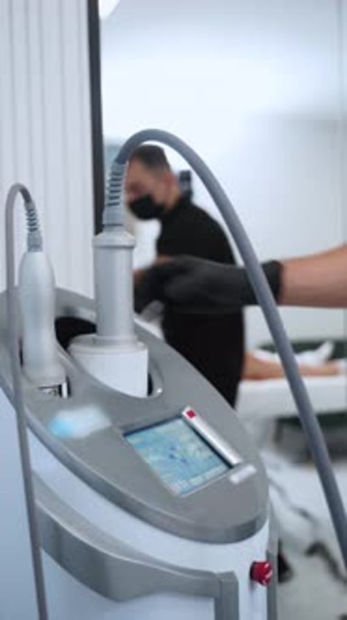 Therapist Performs Anticellulite Treatment Using Endospheres Therapy Machine in Clinic Noninvasive
