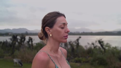 Close Up of Meditating Girl with Closed Eyes - Lakeside Outdoor Yoga