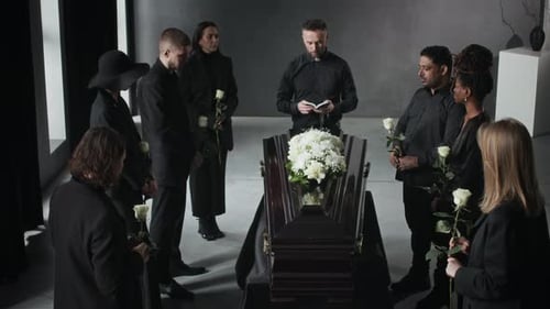 Mourners Gather Around Casket at Funeral Service