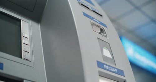 Cash Machine in Airport Terminal Unrecognizable Person Inserting Plastic Credit Card