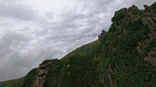 An AweInspiring and Dramatic Mountain Landscape Set Against Cloudy Skies Above