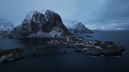 Witness Lofoten Islands' Winter Wonderland in Aerial Drone View Night Blue Sky and Red Rorbuer