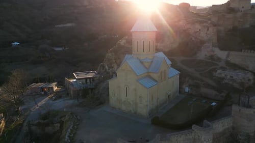 Aerial View of the Ancient Narikala Fortress at Sunset Saint Nicholas Church in Tbilisi Georgia