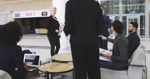 Businesspeople shaking hands during a meeting in a modern office