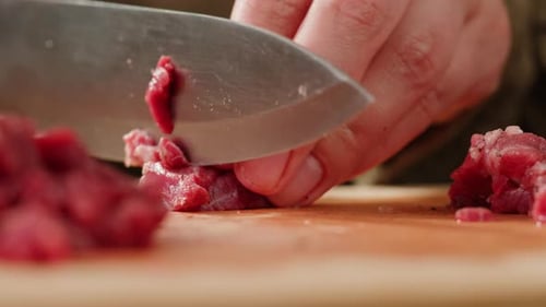 Dicing Raw Red Meat with Sharp Knife