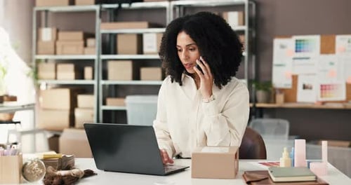 Woman Works on Laptop Talking on Cellphone