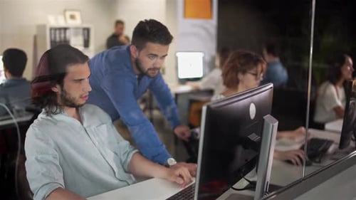Men Colleagues Discuss Online Project Look at Pc Screen Mentor Teaches Young Man Explains Corporate