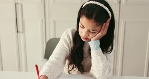Kid, student and unhappy with writing at house, frustrated or angry with notebook for education