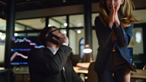 Teamwork joy in dark office stock market managers celebrate successful deal victory
