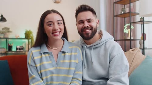 Cheerful Couple Video Chatting at Home