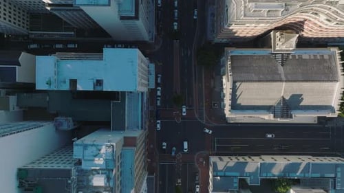 Aerial Birds Eye Overhead Top Down Panning View of Buildings Along Street in City Centre