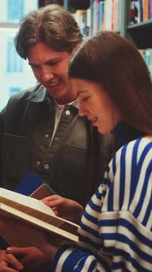 Vertical Screen Students Smiling and Studying Together in Library