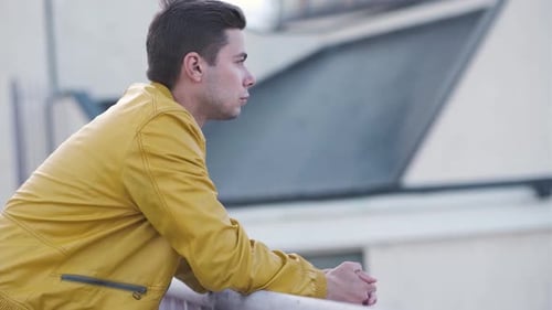 Close Up Portrait of Handsome Man in Yellow Jacket Walking Outdoors