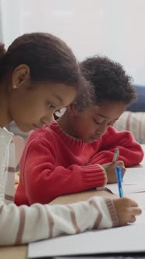 Kids Doing Homework at Table