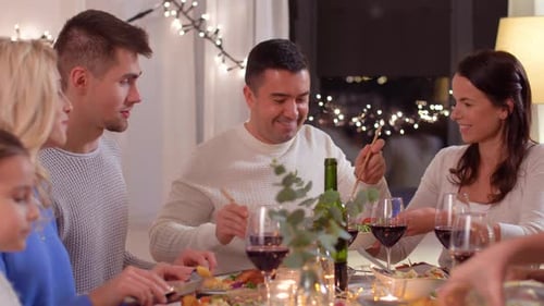 Family and Friends Enjoying Festive Dinner Together at Home