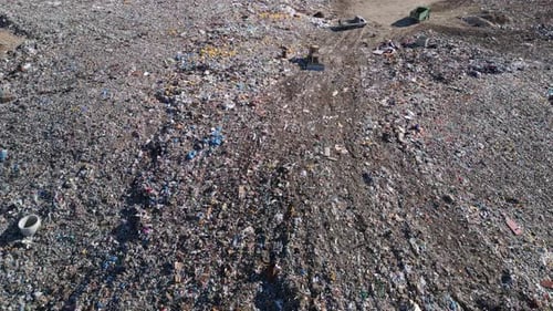 Aerial View of a Vast Landfill Where Bulldozers are Working and Trucks are Bringing New Waste Huge