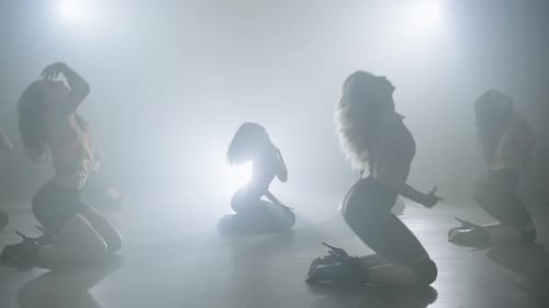 Women Gracefully Dancing on Knees in Smoky Studio