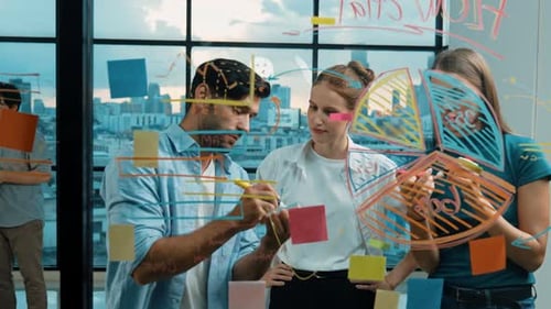 Professionals Brainstorming and Planning on Glass Whiteboard