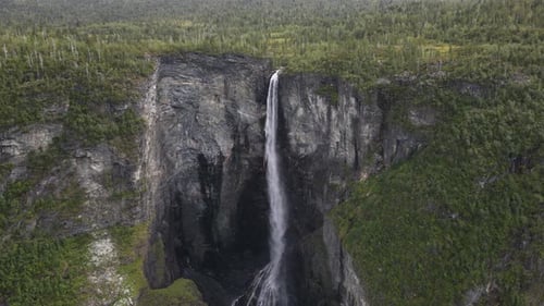 Flying towards Vettisfossen waterfall in Norway. Drone footage