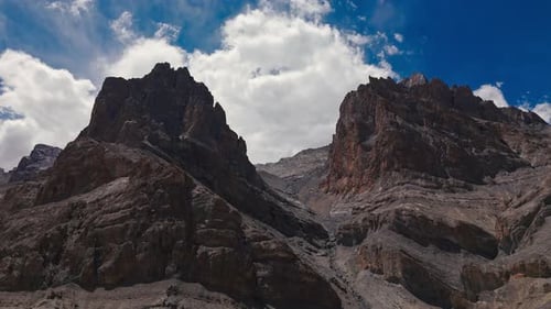 Towering Rocky Cliffs with Mountain Gap Below