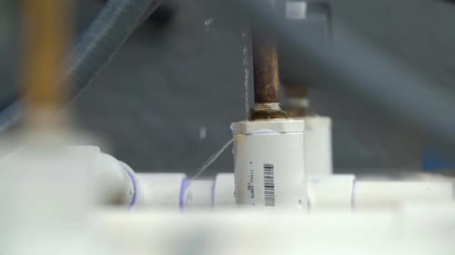 Leaking Water From Plastic Pipes of Outdoor Water Treatment System of American House