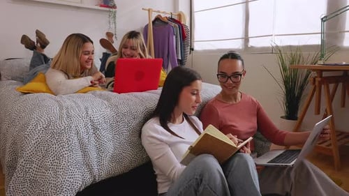 Friends Relaxing, Studying Together in Sunny Bedroom
