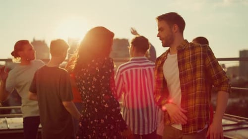 Diverse Group of Friends Dancing at Rooftop Party