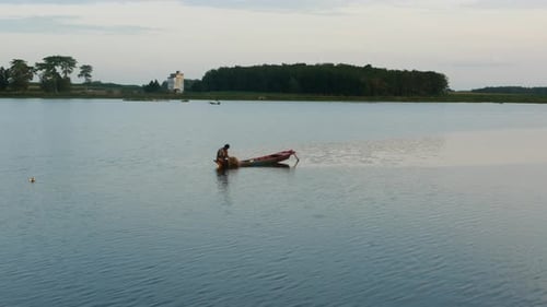 fishermen net fish on traditional wooden boats