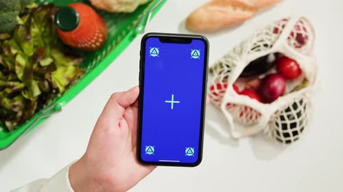 Food Shopping Delivery Online Shop Application Smartphone with Blue Chroma Key Screen and Fresh