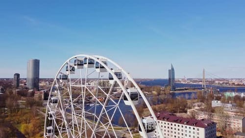 Drone Shot of a Ferris Wheel and Cityscape