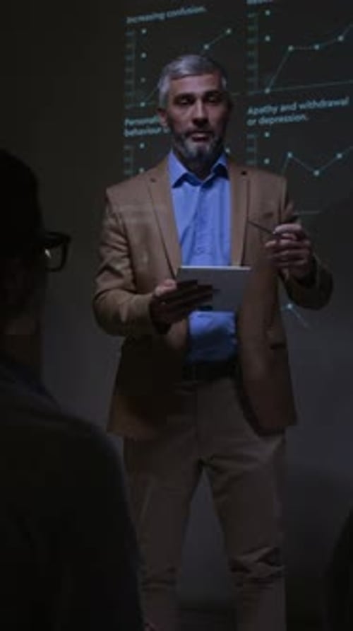 Neuroscientist Explaining Cognitive Data during Seminar Presentation