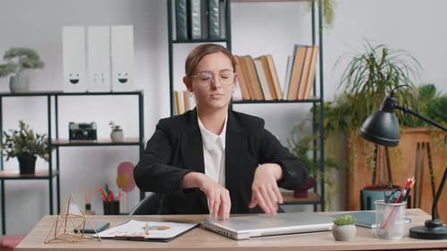 Businesswoman Working on Laptop Meditating Doing Yoga Breathing Exercise in Lotus Position at Office