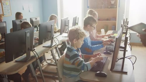 Elementary School Computer Science Classroom: Diverse Group of Little Smart Schoolchildren using Pe