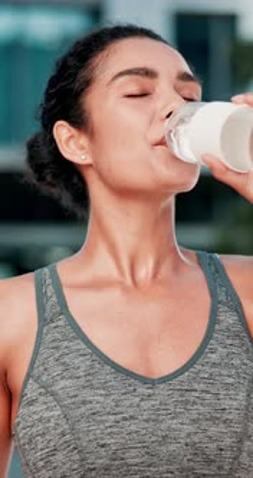 Outdoor, woman and fitness with water for drinking, hydration and liquid beverage for workout break