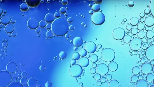 Abstract Translucent Blue Bubbles Floating in a Liquid