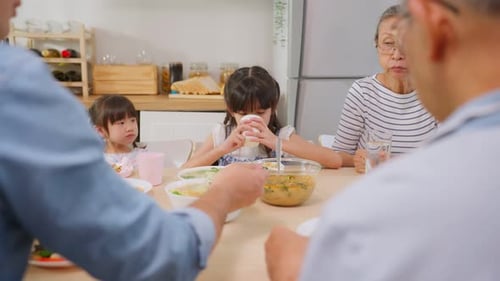 Multigenerational Family Eating Together at Home