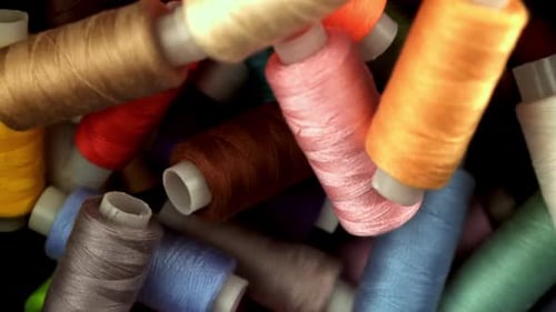 Multicolored Threads Fall on the Table Filmed on a Highspeed Camera at 1000 Fps