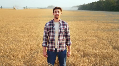 Portrait of Happy Farmer Standing in Ripe Wheat Field with Arms Crossing on Chest Proud Agronomist