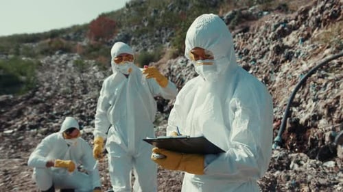 Scientists Wearing Protective Gear Conduct Important Field Research to Ensure Safety
