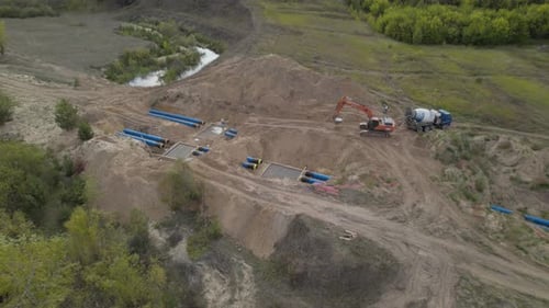 Construction Site Aerial View with Excavator and Truck