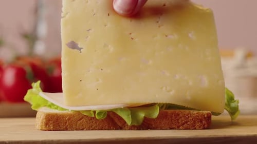 Making a Sandwich with Ham, Cheese, and Lettuce