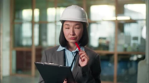 Thoughtful Asian Woman Builder Architect Thinking Building Plan Contractor Korean Chinese Japanese