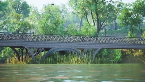 Ruhiger Blick auf eine historische Brücke, umgeben von üppigem Grün im Sommer