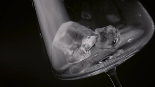 Cold Ice Cubes Falling in Goblet Close Up