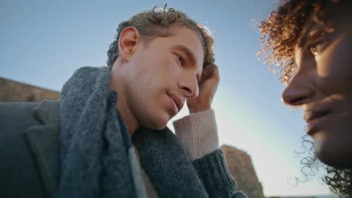 Romantic Young Couple Talking Outdoors During the Day